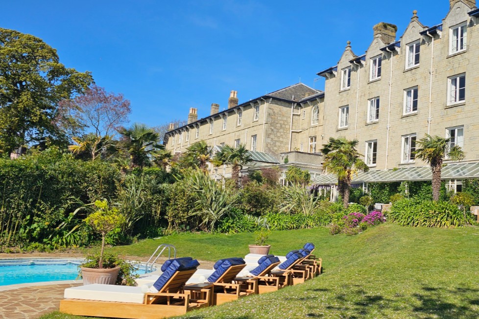 The Royal Hotel on the Isle of Wight with outdoor pool, gardens and sun loungers.