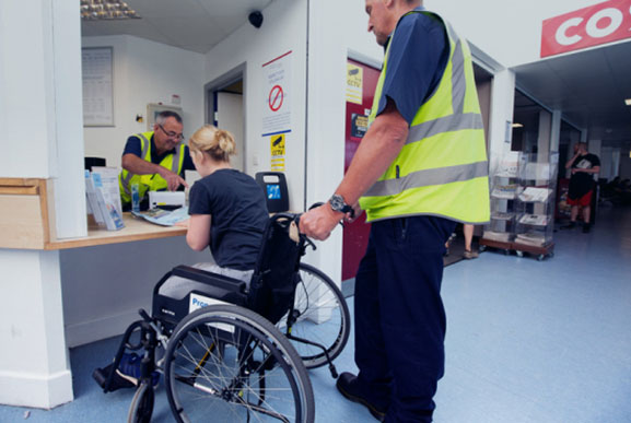 Wheelchair user purchasing a Blue Badge discount ferry ticket