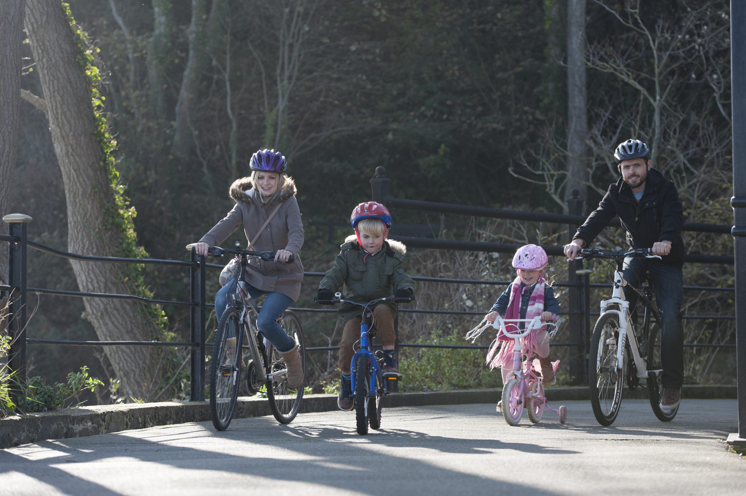 A young family cycling on the Isle of Wight