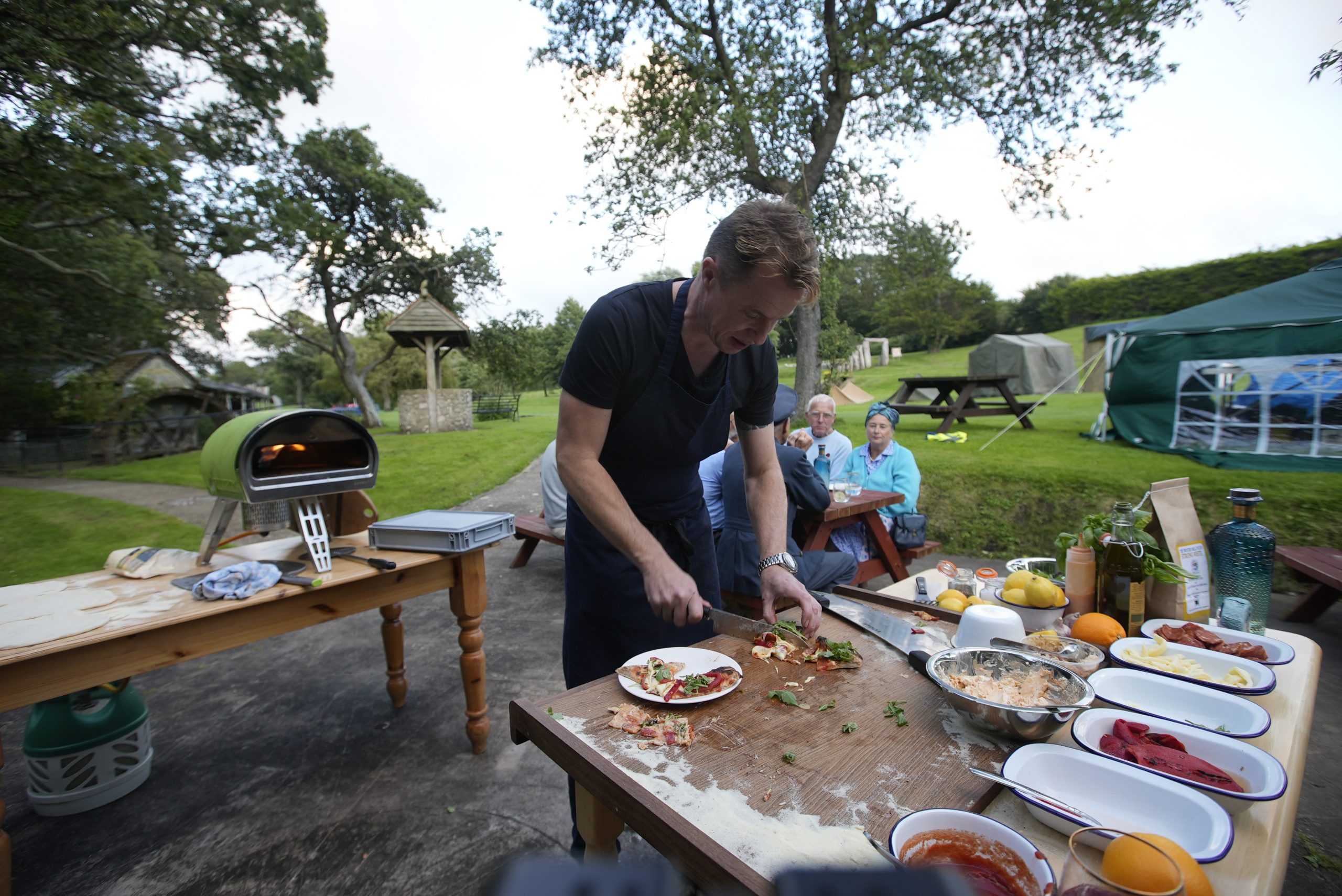 James Tanner Preparing a pizza on the Isle of Wight