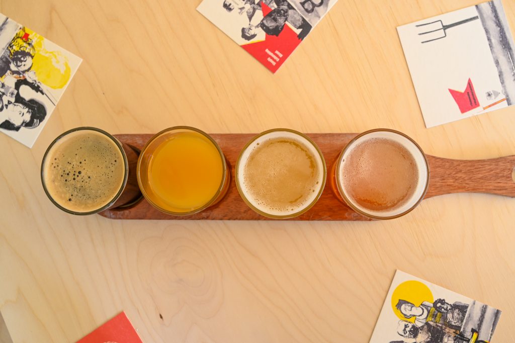 A paddle of four beers lined up for tasting at Boojum&Snark brewery, Isle of Wight