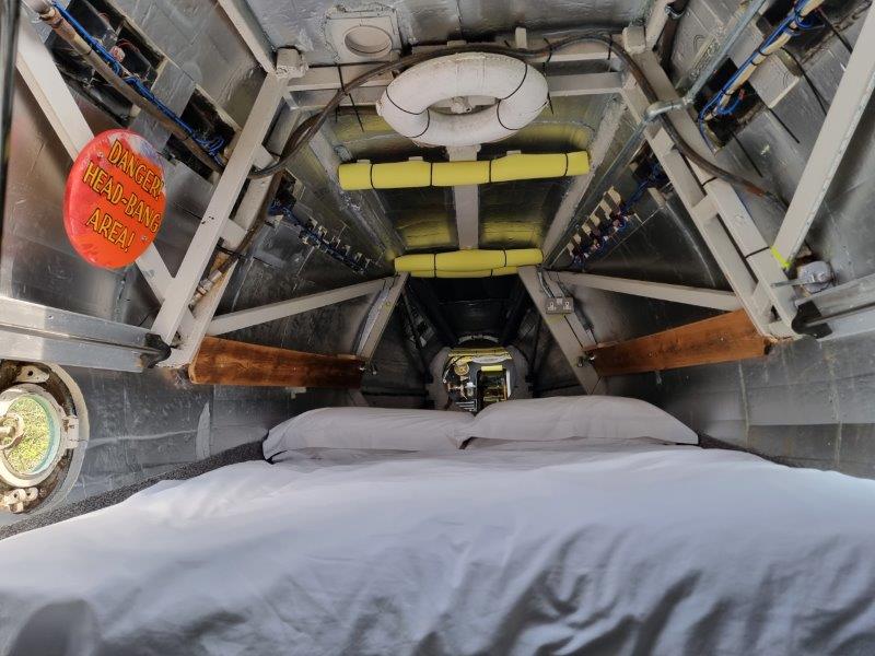 Double bed inside HMS Bond, Windmill Campersite, Isle of Wight