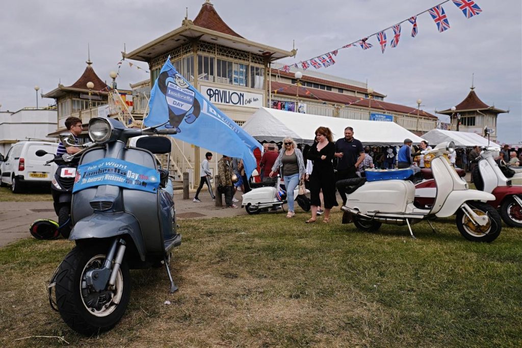 Scooters on the grass outside a building in Ryde on Isle of Wight Lambretta Day
