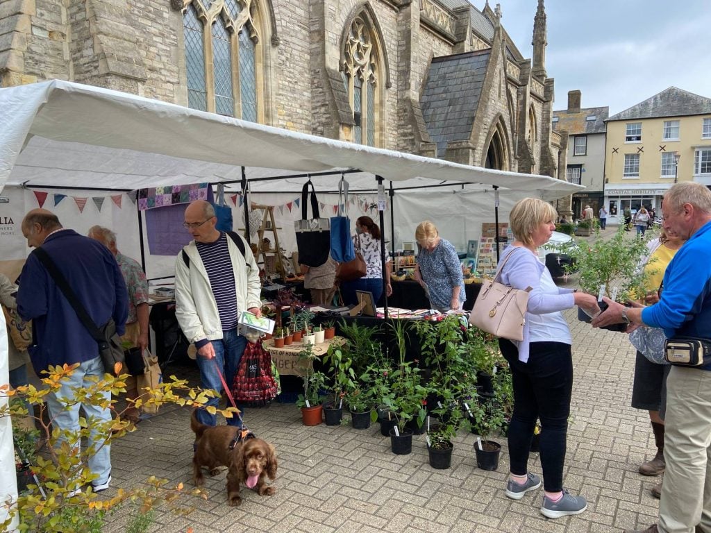 People visiting an artisan market in Newport, Isle of Wight