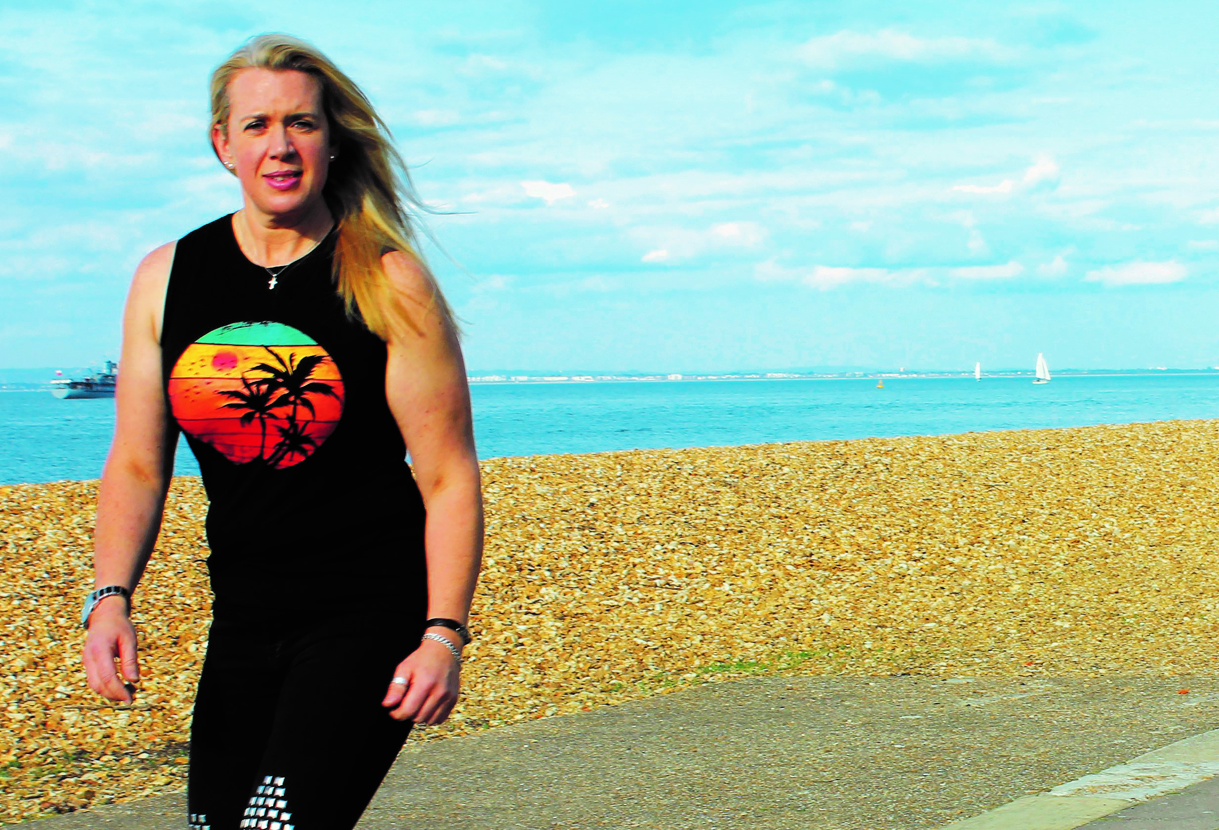 Natalie McAllister from Isle of Wight Roller Skaters, skating on the promenade of a beach