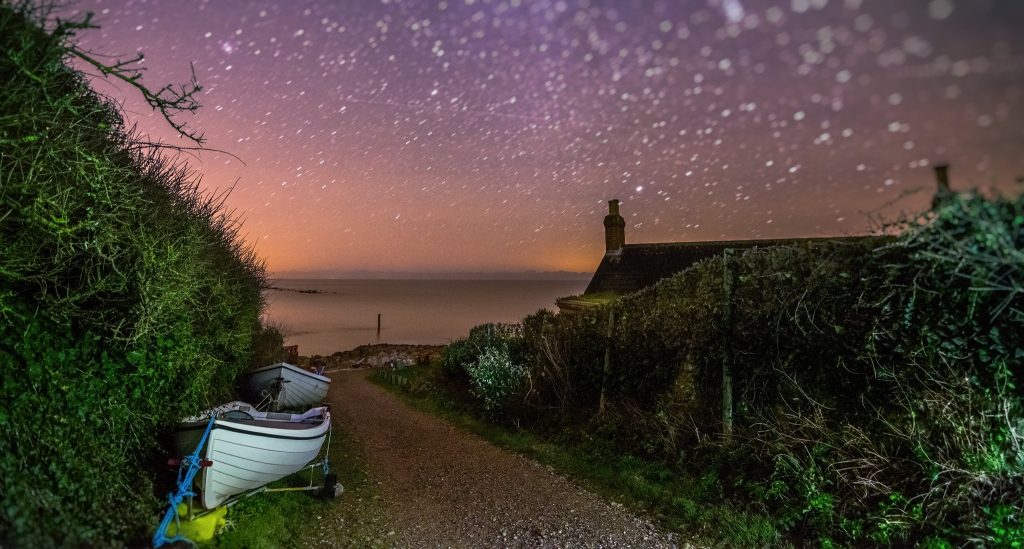 Stars in the dark skies over the sea at Castlehaven, Isle of Wight