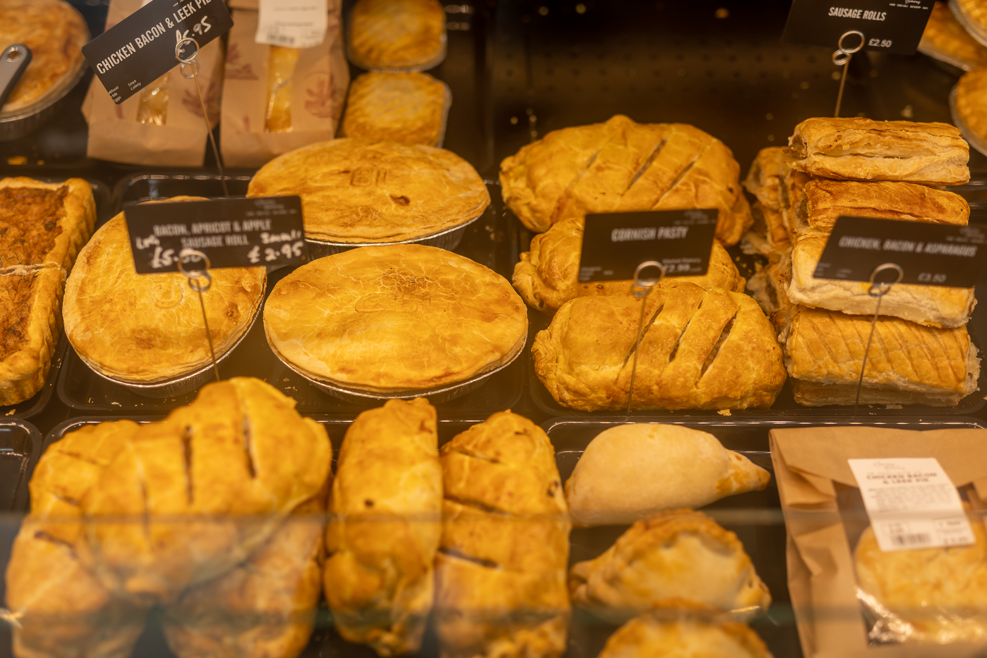 Selection of freshly baked pies, pastries and savouries on display at Harvey Browns.
