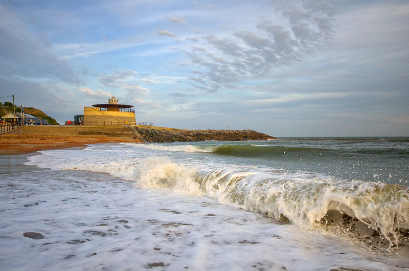 Waves on a beach with a pavilion in the background, Ventnor, Isle of Wight