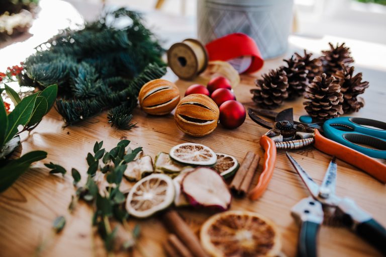 Christmas wreath making materials on a table