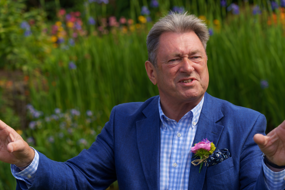 Gardener and presenter Alan Titchmarsh wearing a blue suit