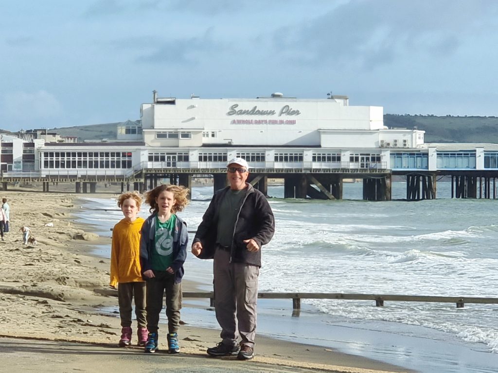 A family standing on the beach at Sandown