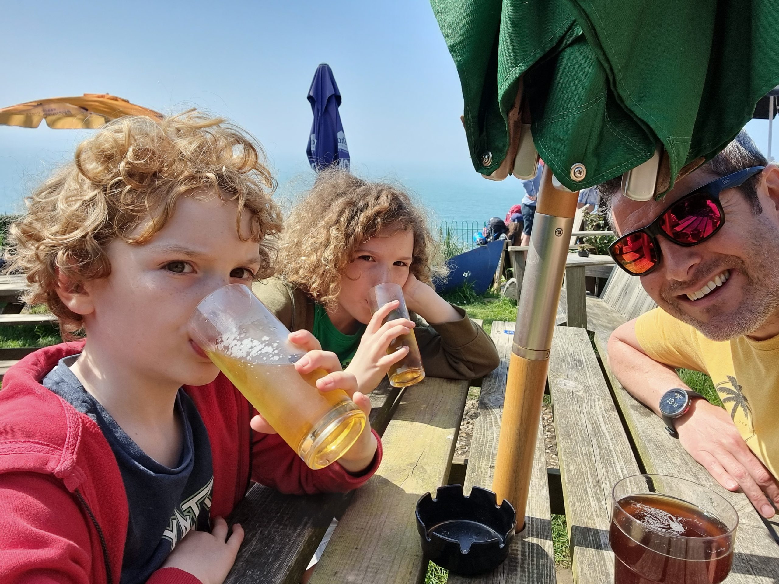 Luke Rees and family enjoying a drink outside a pub on the Isle of Wight