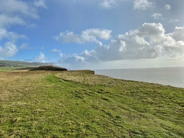 A grassy clifftop overlooking the sea on the Isle of Wight - thanks to Darragh Gray