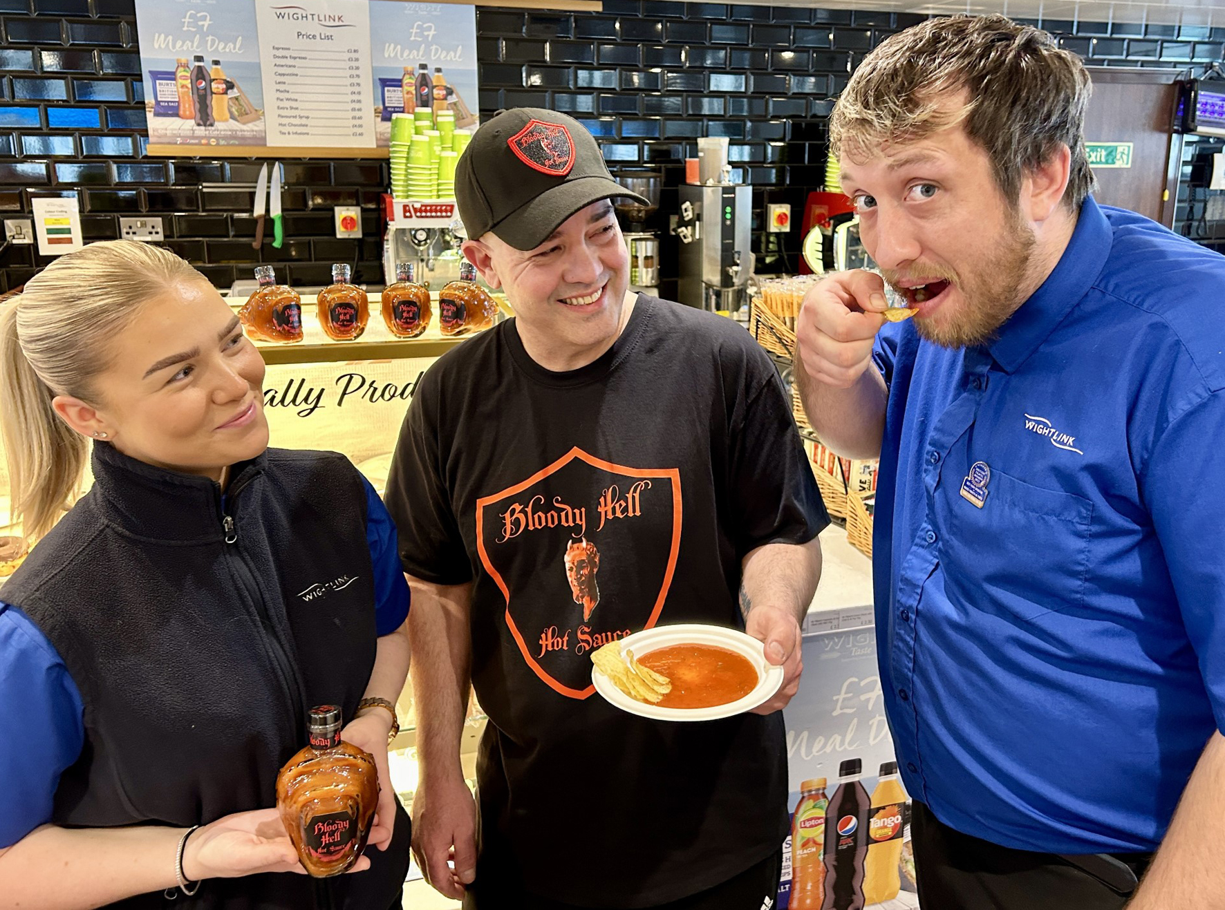 Chief Steward Leah and colleague Josh try out Bloody Hell Hot Sauce on board Wightlink’s Victoria of Wight ferry