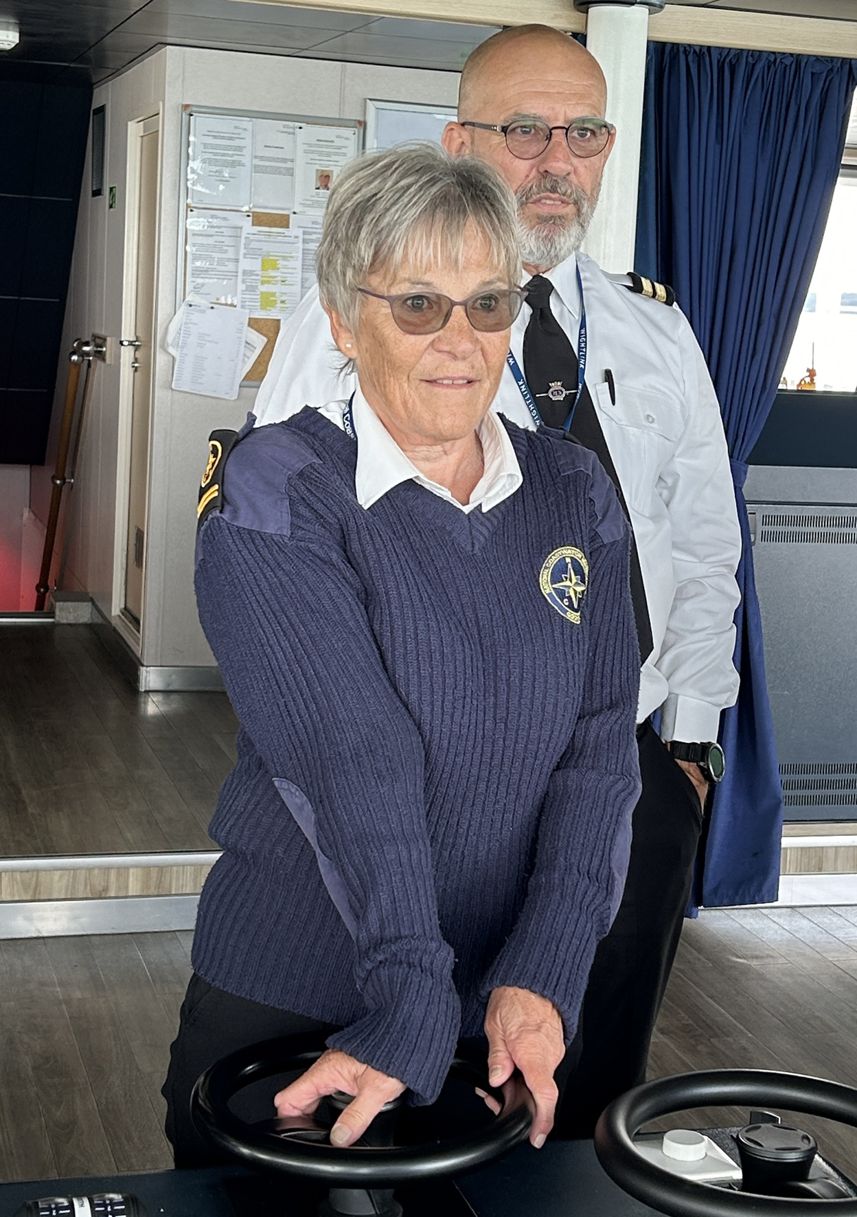 Lenie Stephens-Voorhorst takes the helm of Victoria of Wight under careful supervision from Deck Officer Dave Perry