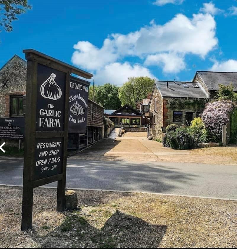 A collection of attractive farm buildings which house a garlic farm