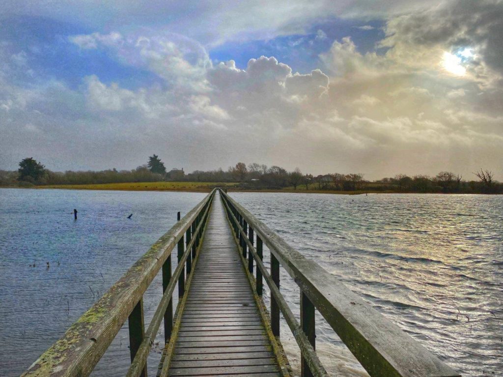 A boardwalk going out to sea