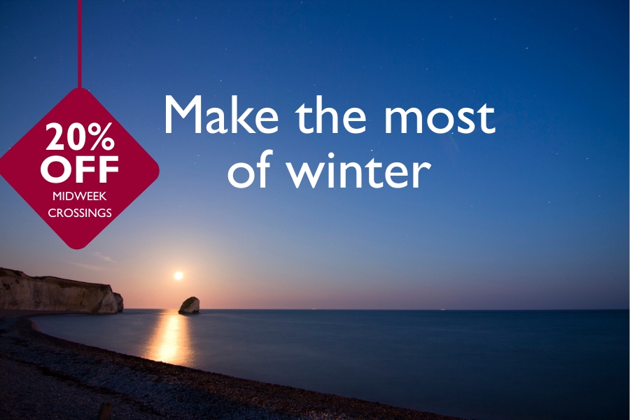 Peaceful sunset at Freshwater Bay on the Isle of Wight, with soft reflections on the sea and a starry sky above. A maroon tag in the top left reads ‘20% OFF MIDWEEK CROSSINGS’.