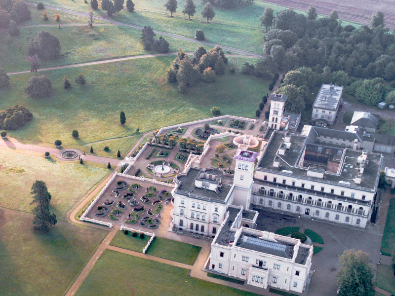 An aerial view of a grand residence in vast grounds - it's Osborne house on the Isle of Wight