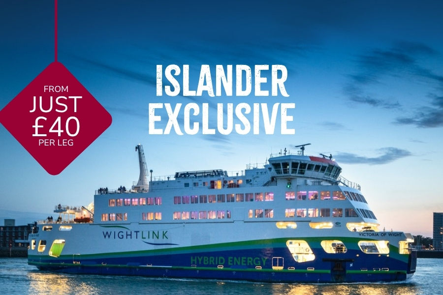 Wightlink’s hybrid ferry Victoria of Wight sailing at dusk with cabin lights glowing, overlaid with “Islander exclusive” and a red badge reading “From just £40 per leg.”