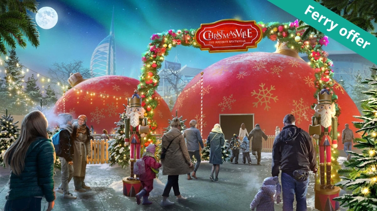 Families walk through a festive entrance arch decorated with lights and nutcracker figures into large red domes labelled “Christmasville,” with Christmas trees and snow-themed decorations. A green banner in the corner reads “Ferry offer.”
