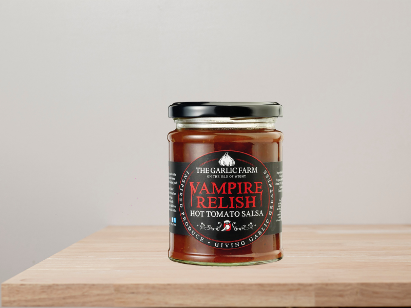 A jar of 'Vampire Relish' from The Garlic Farm, on a wooden worktop