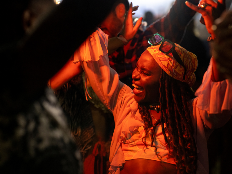 A woman dancing at a music festival.