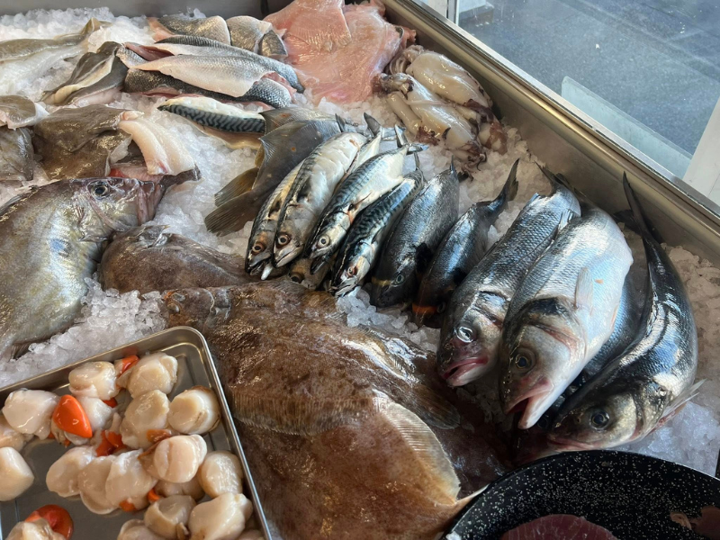 Freshly caught fish on ice in a display unit in a shop on the Isle of Wight