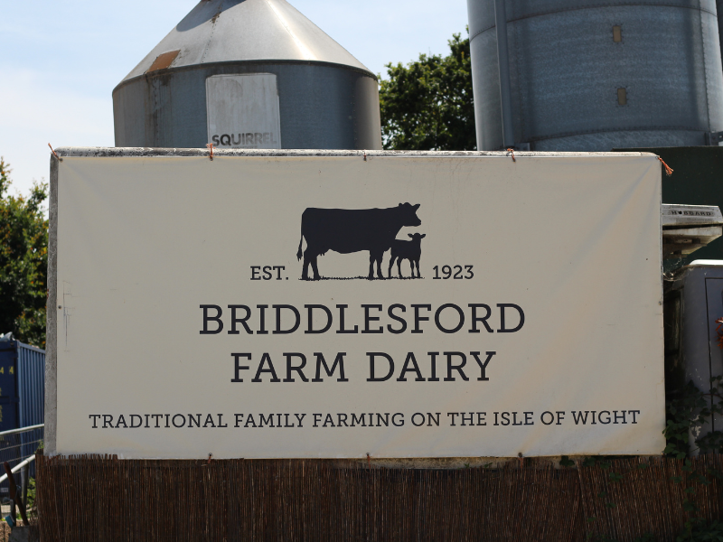 A sign outside a farm saying "Briddlesford Farm Dairy"