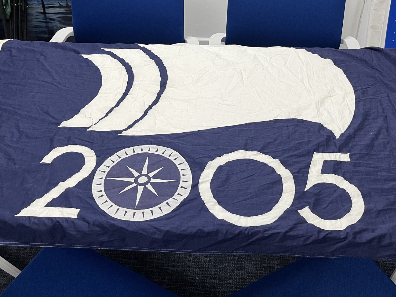 A blue and white flag with '2005' emblazoned on it. It's to celebrate the 200th anniversary of the Battle of Trafalgar