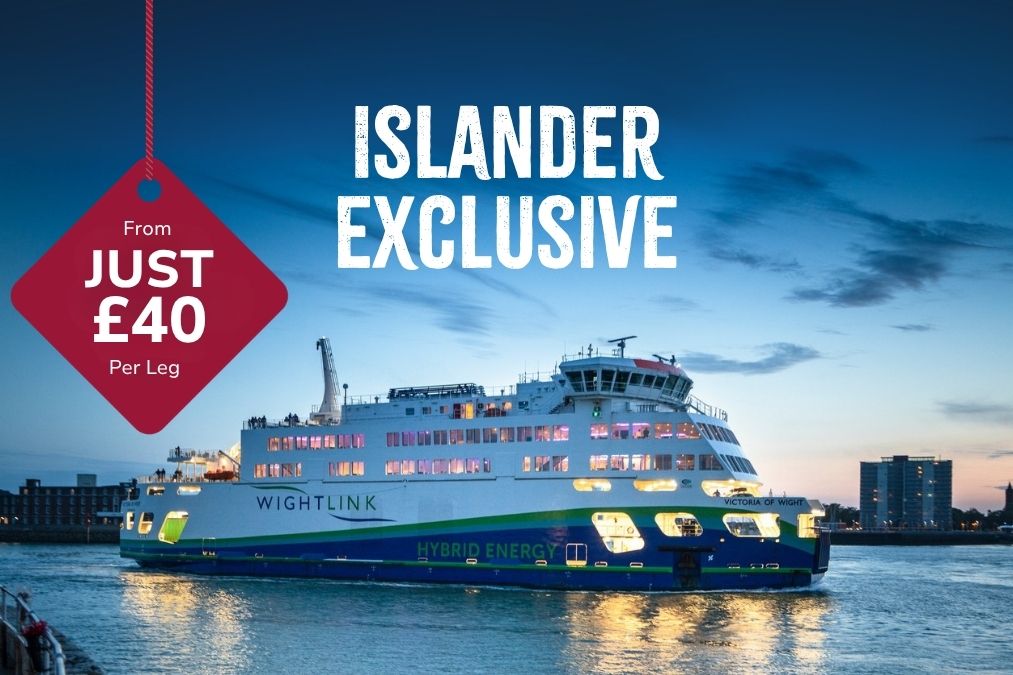 Wightlink’s hybrid ferry Victoria of Wight sailing at dusk with cabin lights glowing, overlaid with “Islander exclusive” and a red badge reading “From just £40 per leg.”