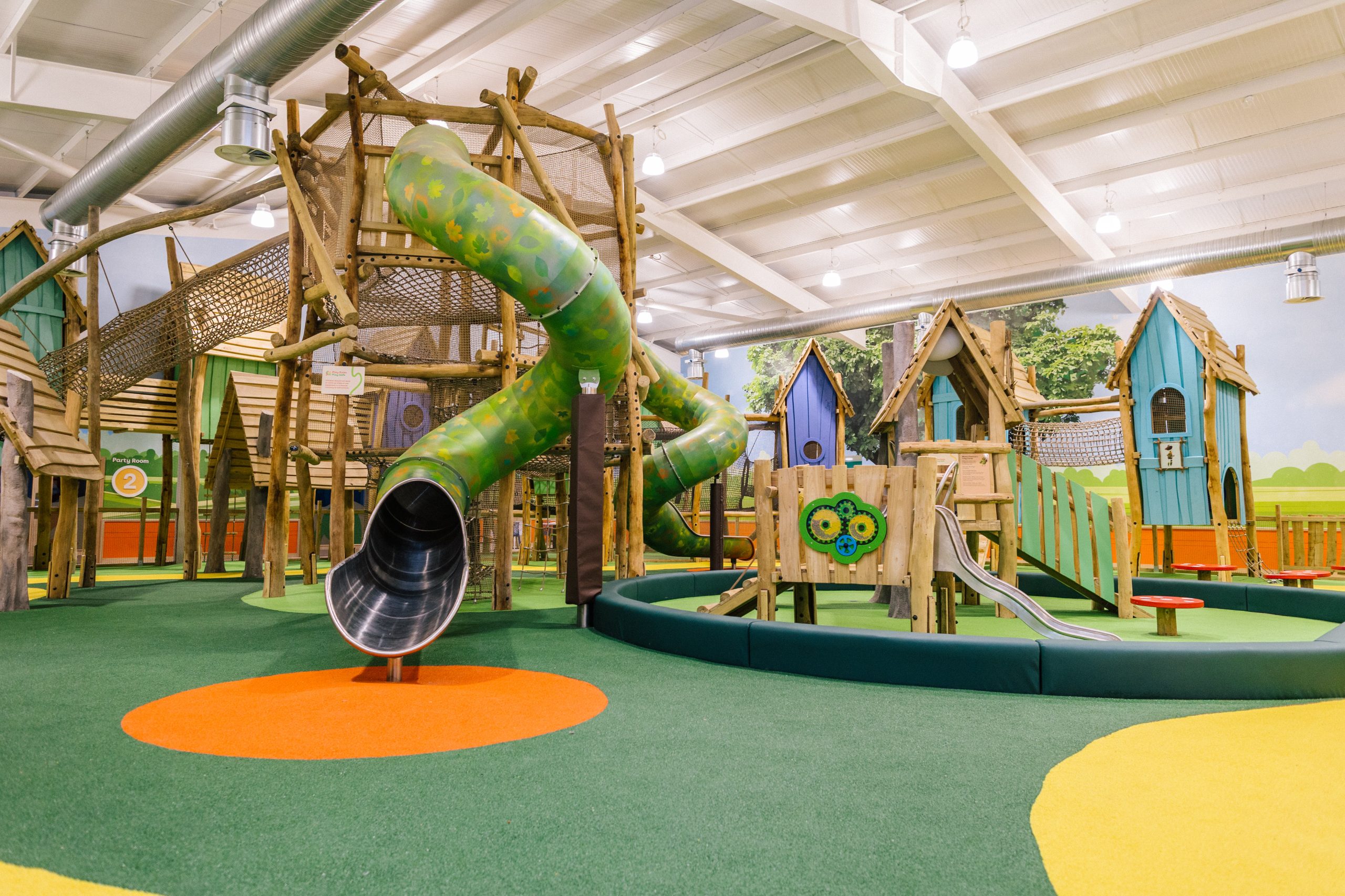 Indoor adventure play area at Birdworld featuring climbing frames, tunnels, rope bridges and slides.