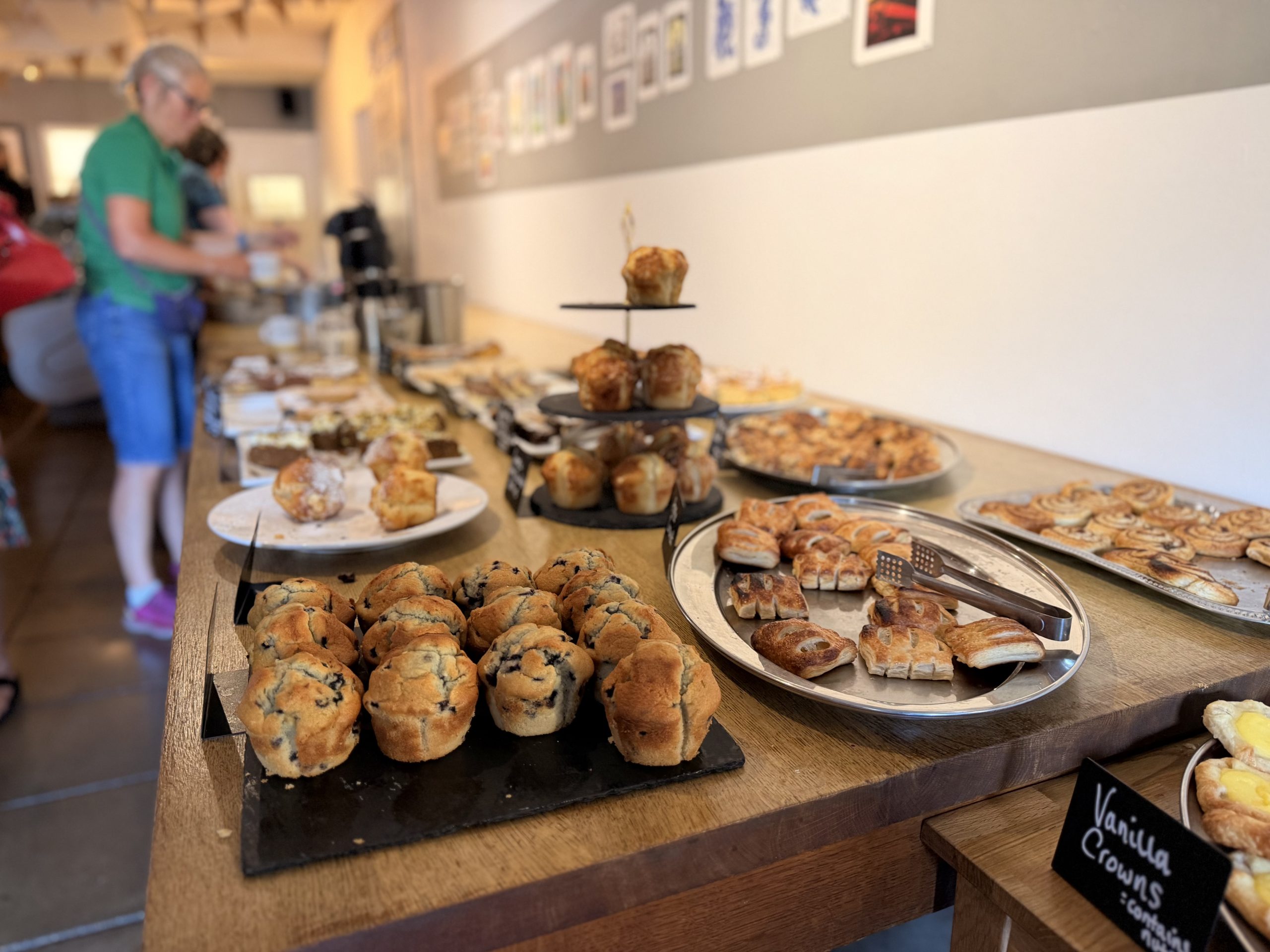 Selection of cakes, pastries and refreshments laid out on a buffet table during Wightlink’s annual Community celebration event at Quay Arts.