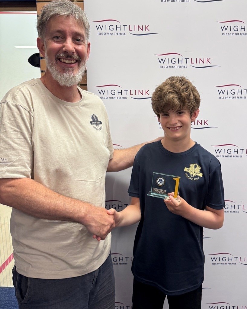 Junior squash player receives an award presentation at the IW Classic squash tournament at Westridge Squash Courts.