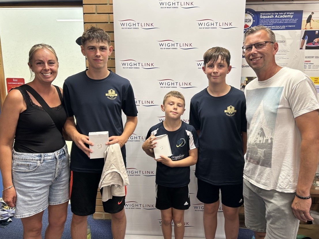 Family competitors from Yorkshire pose with tournament prizes at the inaugural IW Classic squash tournament on the Isle of Wight.