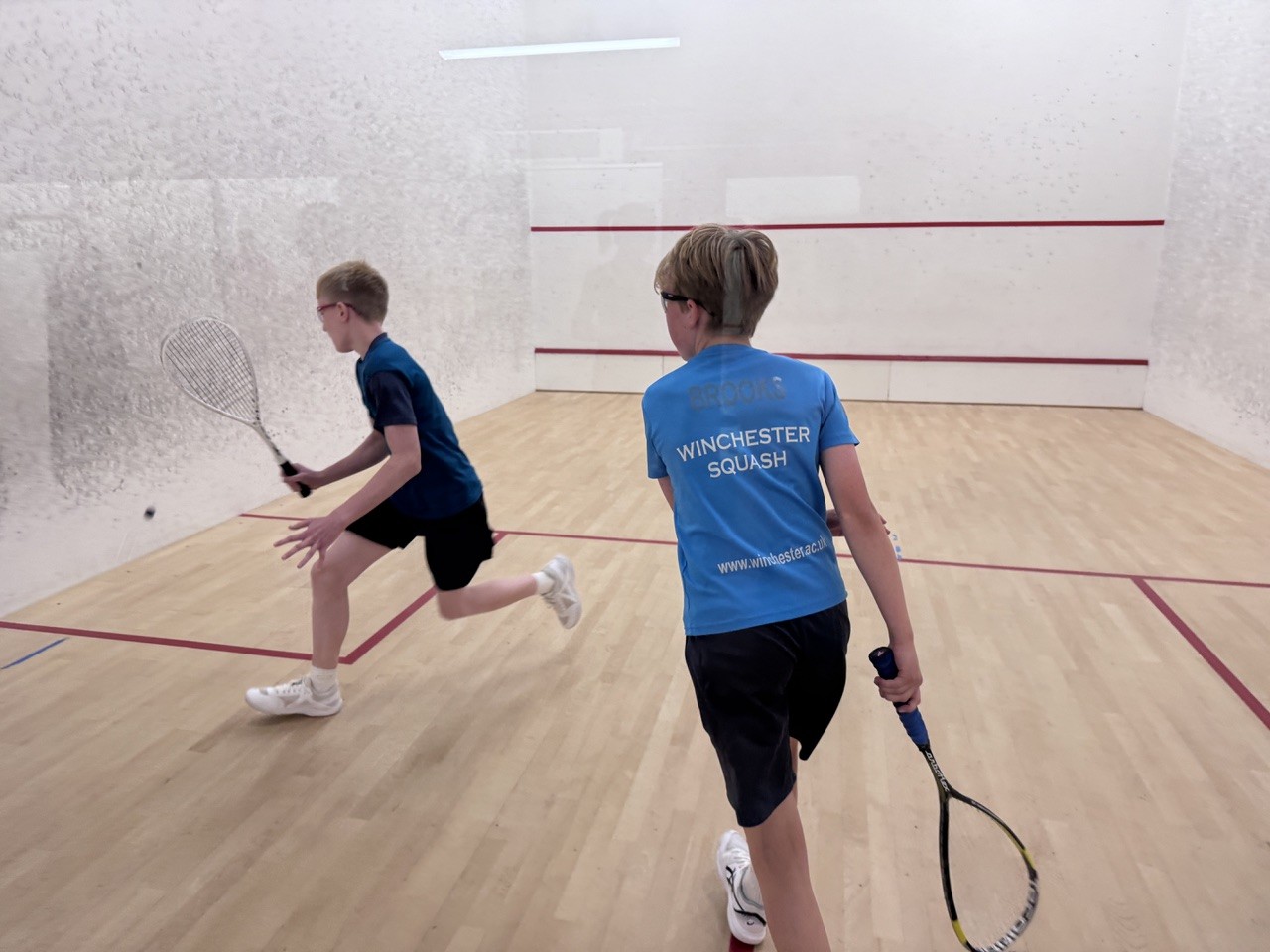 Two junior players compete during a squash match at the inaugural IW Classic tournament on the Isle of Wight.