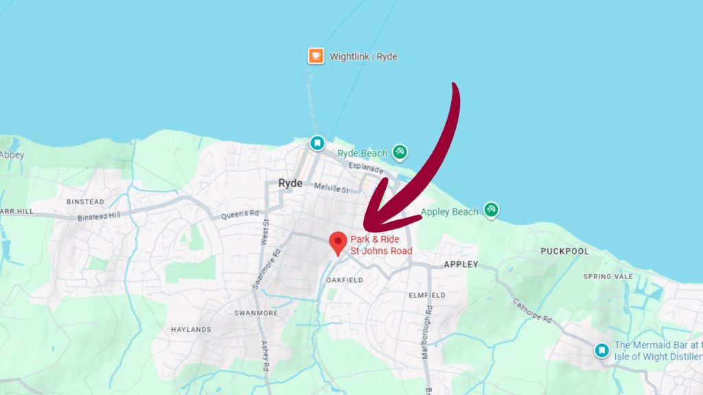 Map of Ryde on the Isle of Wight showing the location of the St John’s Road Park & Ride. A large red arrow points to a map marker labelled “Park & Ride St Johns Road”, located between Ryde town centre and Appley Beach, with nearby landmarks including Ryde Beach and Wightlink Ryde Pier.